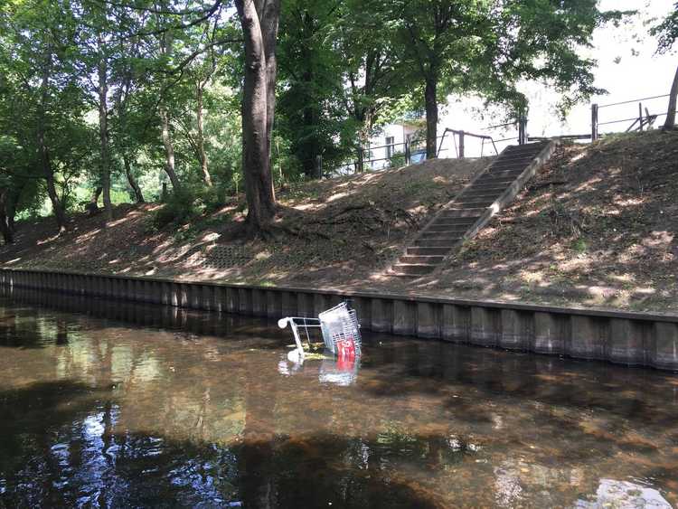 shopping cart in river